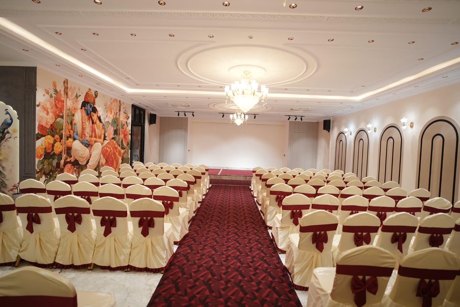 Air-conditioned hall set with maroon and cream chair covers